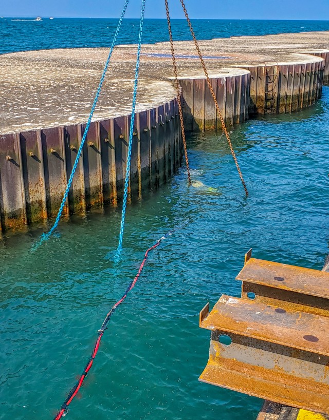 A diver from the U.S. Army Corps of Engineers Buffalo District contractor Great Lakes Dock and Materials, LLC seacrhes for cracks along the Lorain Harbor breakwater's cells, Lorain, OH, July 17, 2020.