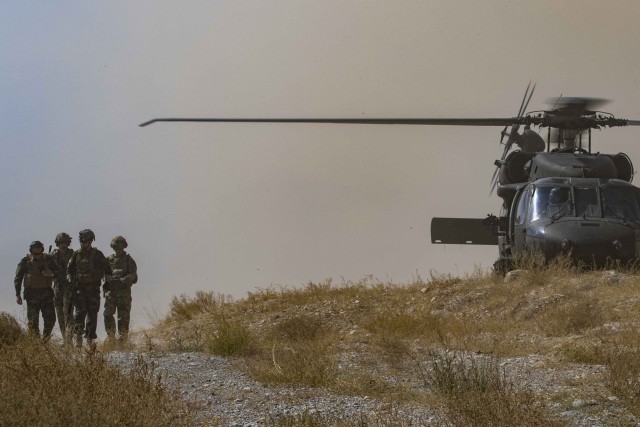 Afghan National Army Soldiers assigned to the 203rd Thunder Corps, Afghan National Army, accompanied by Soldiers assigned to the Headquarters and Headquarters Battalion, 1st Armored Division walk off a UH-60 Blackhawk Helicopter and move to an over watch position during a Afghan-led clearance operation in Southeastern Afghanistan, Sept 25, 2019. Elements of the 1st Armored Division headquarters, out of Fort Bliss, Texas, are deployed in support of Operation Resolution Support and Freedom&#39;s Sentinel in support of our Afghan partners. Resolute Support is a NATO-led, non-combat mission to train, advise and assist the Afghan National Defense and Security Forces (ANDSF). 