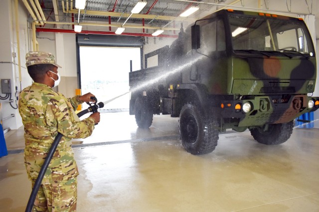 Spc. Eeralle Jones, assigned to the 38th Air Defense Artillery Brigade, washes a truck at the U.S. Army Garrison Japan Wash Rack at Sagami General Depot, Japan, Sept. 21.