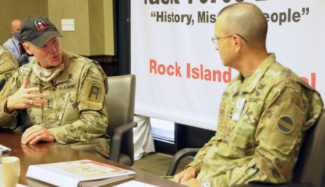 Lt. Gen. Thomas James Jr., First Army commanding general, talks with Lt. Gen. Leopoldo Quintas Jr., FORSCOM deputy commanding general, during the Large Scale Mobilization Operations forum on Rock Island Arsenal, Ill.