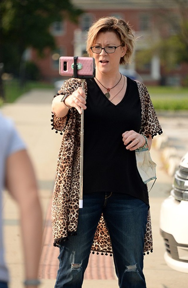 Michelle Taylor, Catholic community coordinator, turns the camera on herself as introductions are made to an audience watching on Facebook during the Women of St. Ignatius/Catholic Women of the Chapel kick-off event Sept. 17 outside Frontier Chapel. Photo by Prudence Siebert/Fort Leavenworth Lamp