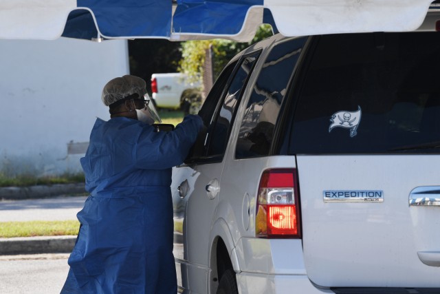 A worker from the Medical University of South Carolina administers a test during drive thru COVID testing on Fort Jackson Sept. 22. MUSC and Fort Jackson partnered together to give the testing to the installation community.