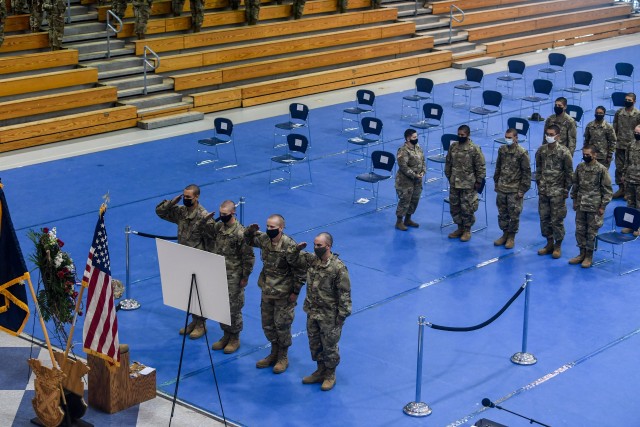 Soldiers of Company E, 1st Battalion, 13th Infantry Regiment, render a final salute to Pvt. Michael Wise following his memorial service at the Solomon Center Sept. 19.