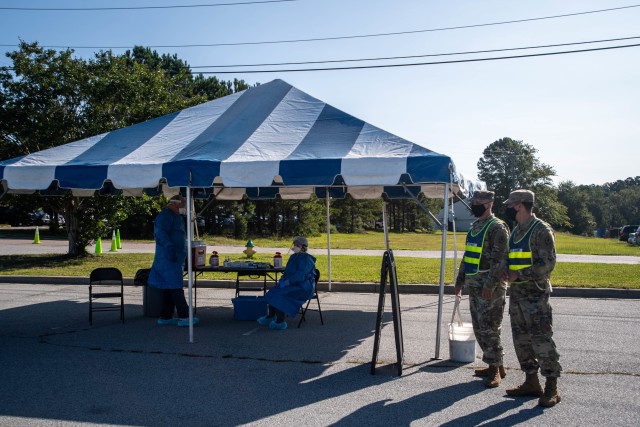 Soldiers and MUSC COVID responders wait for patients to arrive during drive-thru COVID testing Sept. 22.
