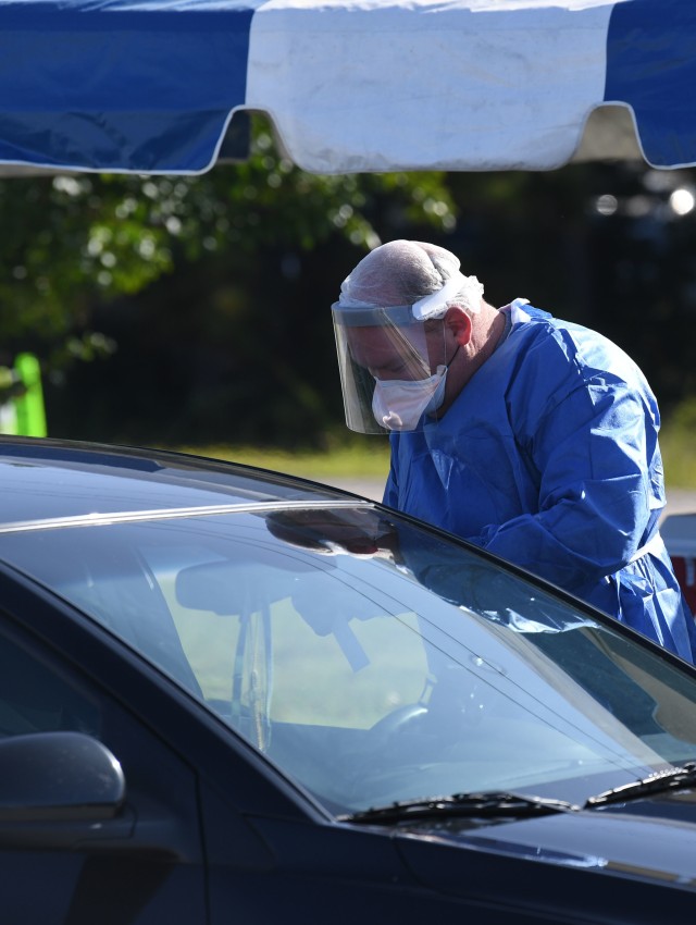 A worker with the Medical University of South Carolina administers a COVID test on Fort Jackson Sept. 22. The university and Fort Jackson teamed up to provide drive thru coronavirus testing Sept. 22 and 24. It was the second time they teamed up to...