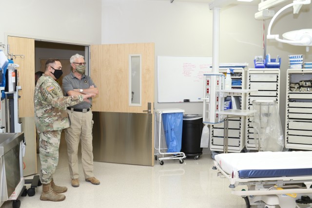 Col. Luis Rivero, deputy commander for clinical services for Weed Army Community Hospital, shows Under Secretary of the Army James McPherson a trauma room inside the hospital September 20 at Fort Irwin, Calif. (Photo by Kimberly Hackbarth, WACH Public Affairs)