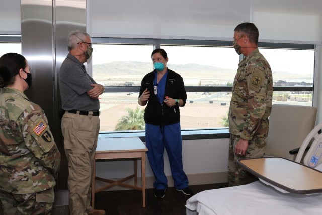 Capt. Jennifer Bullis, a labor and delivery nurse with Weed Army Community Hospital, discusses the department’s capabilities with James McPherson (second from left), under secretary of the Army, and Gen. Joseph Martin (far right), vice chief of staff of the Army, September 20 at Weed ACH at Fort Irwin, Calif.. (Photo by Kimberly Hackbarth, WACH Public Affairs)