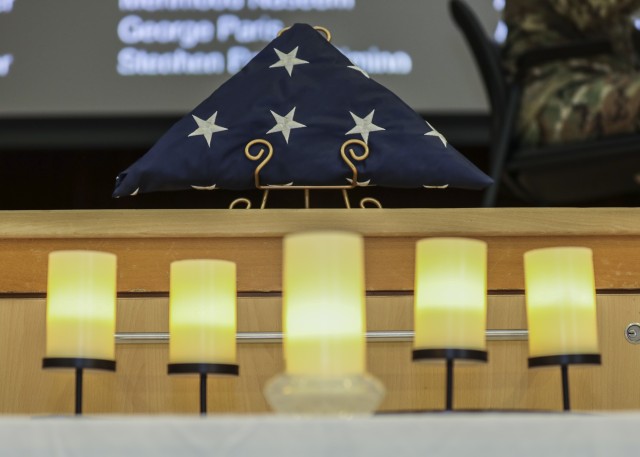 A folded American flag and candles symbolizing events during the 9/11 attacks were displayed during Landstuhl Regional Medical Center’s 9/11 Remembrance, Sept. 11.
