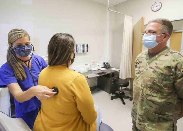(Left) Natalie Svendsen, a student participating in Landstuhl Regional Medical Center’s College Practicum Program, listens for abnormalities in a patient while U.S. Army Lt. Col. Kenneth Ford, officer in charge, Family Medicine Clinic, precepts,...
