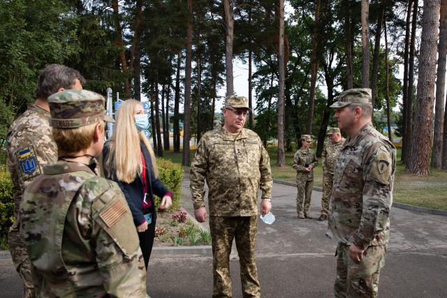 U.S Army Europe Chief Information Officer Brig. Gen. Joseph Papenfus (right) speaks to Armed Forces Ukraine General Pavlo Tkachuk shortly after arriving to Collective Training Center-Yavoriv, Ukraine, for an official visit Sept. 24. (Photo by Cpl....