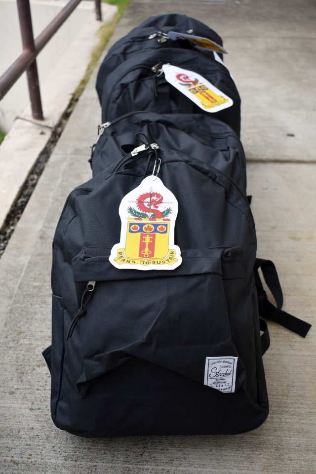 Backpacks full of school supplies included tags with the 35th Combat Sustainment Support Battalion’s motto “Means to Sustain” at Zama Middle High School, Camp Zama, Japan, Sept. 24.
