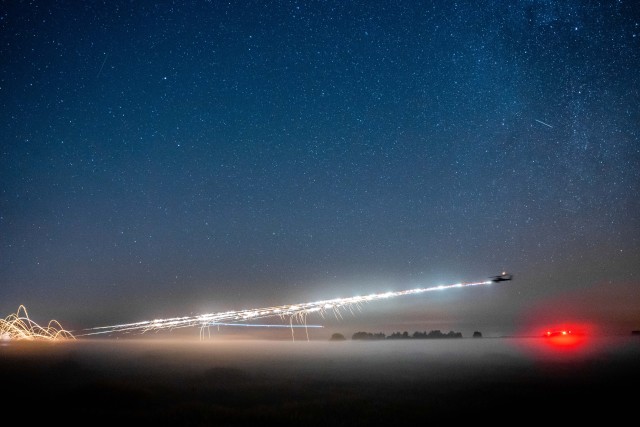 AH -64 Apache helicopter from the U.S. 1-101st Combat Aviation Brigade, conducts night live fire.