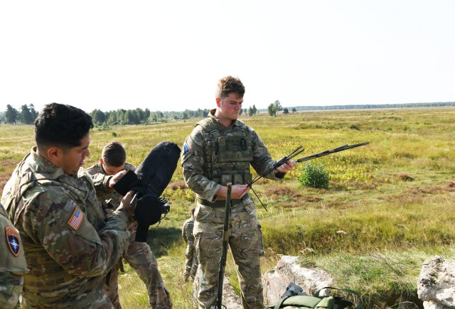 British and American Joint Terminal Attack Controllers setting up observation post for Wojtek Fire Exercise.