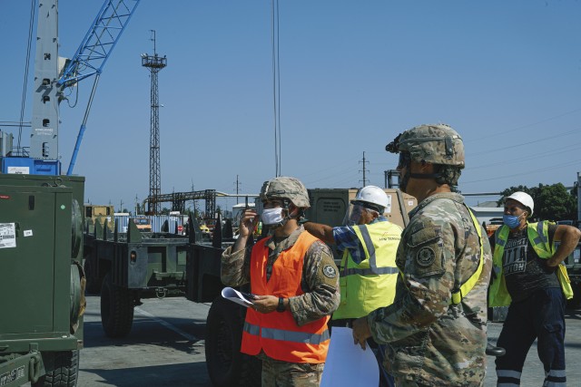 U.S. Army 1st Lt. Alex McCurry (left) and 1st Lt. Aaron Noggle (right), assigned to the 4th Squadron, 2d Cavalry Regiment, check equipment information to ensure it is correct during port operations for the Noble Partner 20 exercise in Poti,...