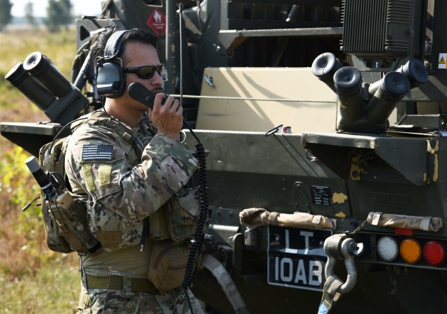 American Joint Terminal Attack Controller communicates with 101st Airborne AH64 Apache’s during Wojtek Fire Exercise