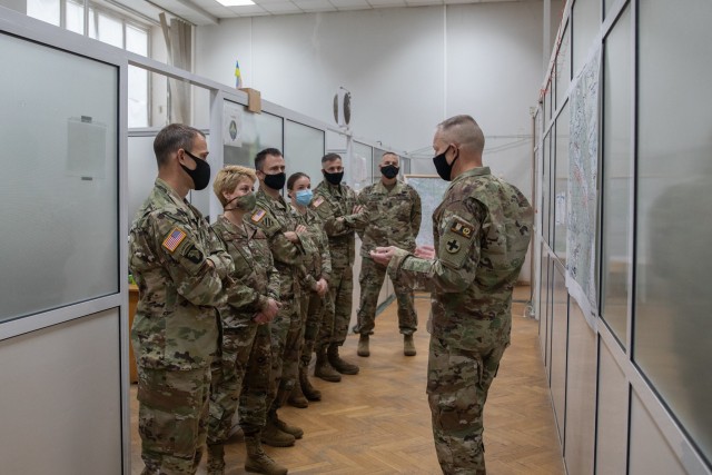 Task Force Illini commander, Col. Clayton Kuetemeyer briefs personnel from the U.S. Embassy in Kiev, Ukraine, about the Joint Multinational Training Group-Ukraine mission during an official visit Collective Training Center, Yavoriv, Ukraine, Sept....