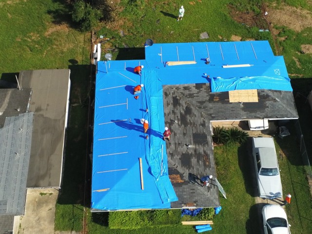 The Corps of Engineers commemorated the one month anniversary of Hurricane Laura making landfall with the installation of the 5000th blue roof in Lake Charles, La., Sept. 27, 2020. Operation Blue Roof is a priority mission managed by the U.S. Army...