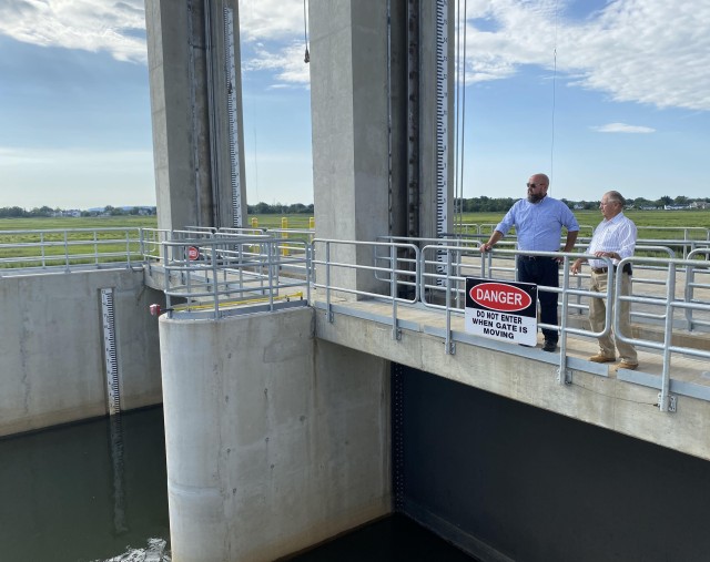 Port Monmouth, New Jersey Resident, Charles Rogers (Right) and Ted Maloney, Township Engineer for Middletown, New Jersey looking over the new flood gate and pump station operation at the Port Monmouth Flood Risk Management Project. Credit: USACE.