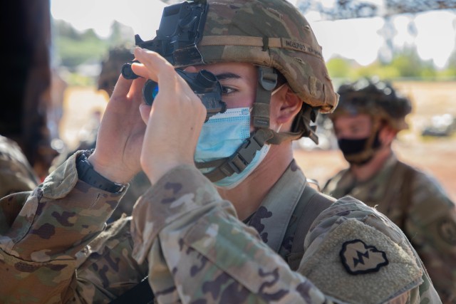 Pfc. Nicco Guzzardo, an infantryman assigned to 2nd Battalion, 35th Infantry Regiment, 3rd Infantry Brigade Combat Team, 25th Infantry Division adjusts a AN/PVS-14 Monocular Night Vision Device (MNVD) during the Expert Infantryman Badge, EIB, testing at Schofield Barracks, Hawaii on Sept. 16, 2020. The EIB was developed in 1943 to recognize Soldiers who show expert proficiency in basic Soldier tasks. 