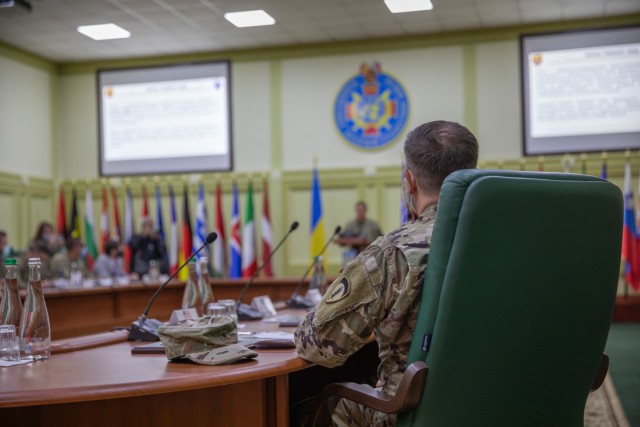 U.S Army Europe Chief Information Officer Brig. Gen. Joseph Papenfus attends a multinational briefing overviewing Rapid Trident 2020 at Collective Training Center-Yavoriv, Ukraine, during an official visit Sept. 24. (Photo by Cpl. Shaylin Quaid,...