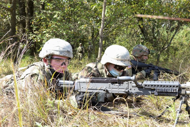 Cadet Thomas Rudrud, left, an MS2 with the Marquette ROTC Battalion, and Cadet Andrew Hruz, an MS3 with Marquette ROTC Battalion, provide cover during tactical training at Fort McCoy, Wis., Sept. 25, 2020. The cadets are conducting training to...