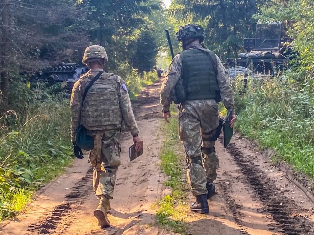 Soldiers from Alpha Battery, 5th Battalion, 4th Air Defense Artillery Regiment integrate with the Lithuanian King Mindaugas Hussars Battalion during tactical convoy and breach of an airbase.