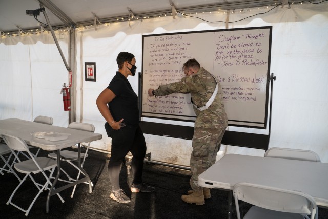 Mrs. Diane Guidry, owner of restaurant "Edith's Place" cracks jokes with U.S. Army Cpt. Jose Chacon, commander of HHC, 7th Trans. Brigade (Expeditionary) during dinner at Port Arthur, Texas, Sep. 26, 2020. Officially contracted by the U.S. Army, the Guidry’s and their staff have been feeding the soldiers of 7th Transportation Brigade (Expeditionary) (7th TB (X)) as they conduct their Sealift Emergency Deployment Readiness Exercise (SEDRE), moving the 2nd Brigade Combat Team, 25th Infantry Division’s (2/25) equipment from Pearl Harbor, Hawaii to the Ports of Port Arthur and Beaumont, Texas in order for 2/25 to continue onward to the Joint Readiness Training Center (JRTC) at Fort Polk, La.   (U.S. Army photo by Sgt. Marygian Barnes, 22nd Mobile Public Affairs Detachment)