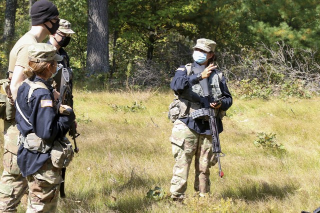 Cadet Alex Pedraza, an MS4 from University of Wisconsin-Parkside, briefs her fellow cadets on the defense plan for the opposition forces during tractical training at Fort McCoy, Wis., Sept. 25, 2020.