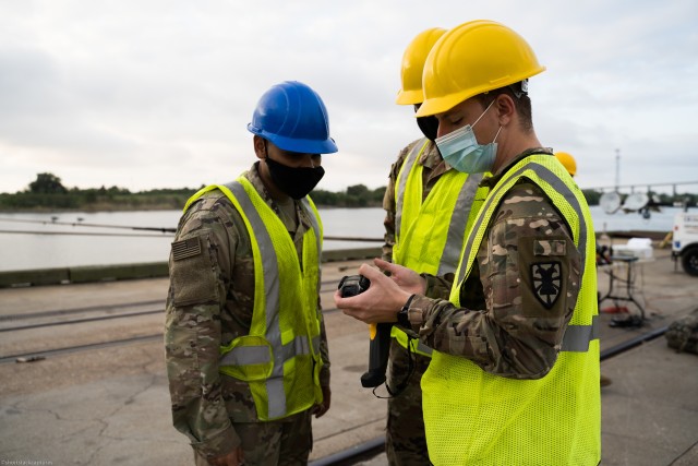U.S. Army Spc. Michael Voss, a Transportation Management Coordinator (88N) with 368th Seaport Operations Company, 11th Transportation Battalion, 7th Transportation Brigade (Expeditionary) demonstrates troubleshooting methods for the Radio...
