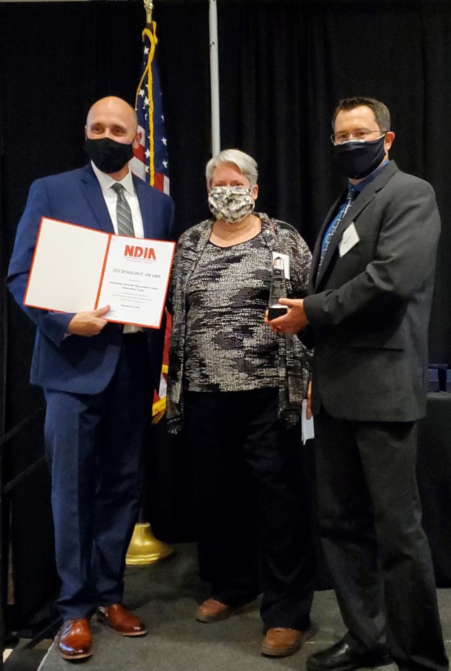 Dan Stewart (left), Cybersecurity & Privacy Division; Katherine Coviello (center), Special Advisor for Materiel Enterprise Intelligence & Security; and Wes Slone, Cybersecurity Compliance Team Lead, at the National Defense Industrial Association...