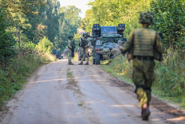 Soldiers from Alpha Battery, 5th Battalion, 4th Air Defense Artillery Regiment integrate with the Lithuanian King Mindaugas Hussars Battalion during tactical convoy and breach of an airbase.