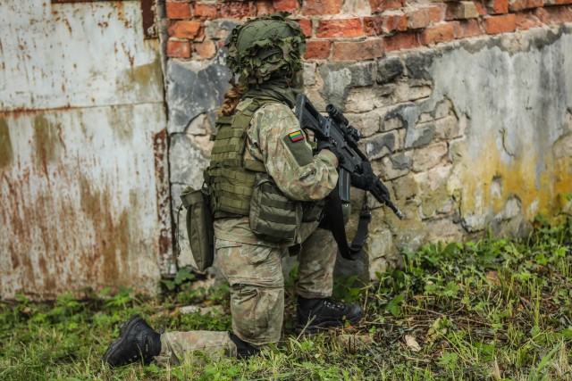 Soldiers from Alpha Battery, 5th Battalion, 4th Air Defense Artillery Regiment integrate with the Lithuanian King Mindaugas Hussars Battalion during tactical convoy and breach of an airbase.