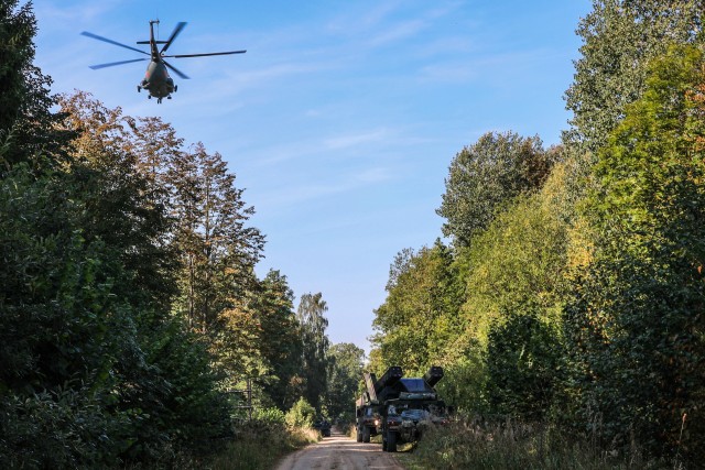Soldiers from Alpha Battery, 5th Battalion, 4th Air Defense Artillery Regiment integrate with the Lithuanian King Mindaugas Hussars Battalion during tactical convoy and breach of an airbase.