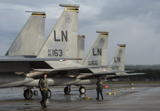 F-15C Eagles assigned to the 493rd Fighter Squadron await completion of pre-flight checks prior to take off in support of exercise Astral Knight 2020 at Royal Air Force Lakenheath, England, Sept. 23, 2020. AK20 is focused on multinational integrated air and missile defense assets and features fighter, and surface-based air defense integration against air and cruise missile threats. (U.S. Air Force photo by Airman 1st Class Jessi Monte)