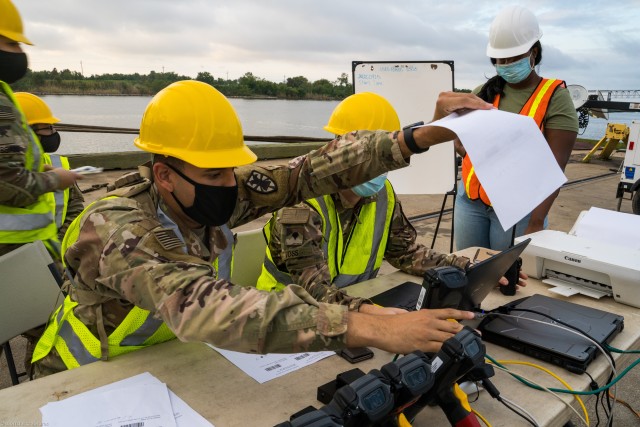 U.S. Army Pvt. Christian Dejesus, a Cargo Specialist (88H) with 368th Seaport Operations Company, 11th Transportation Battalion, 7th Transportation Brigade (Expeditionary), arranges equipment Radio Frequency Identification (RFID) tags in Port...