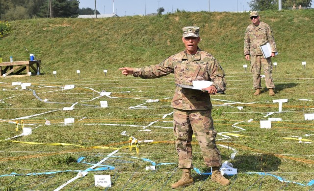 Col. Terry Tillis, the commander of the 2nd Armored Brigade Combat Team, 3rd Infantry Division, discusses his plans to advance across the mock battlefield during a combined arms rehearsal in advance of Combined Resolve XIV on Sept. 16, 2020, at Hohenfels Training Area, Germany. The 2nd Armored Brigade Combat Team is set to be assessed and evaluated on its ability to fight and win on the battlefield during Combined Resolve XIV. The exercise is scheduled to run until September 29. Units from the United States and seven other NATO ally and partner countries will team to both assist the 2nd ABCT and portray its opposition forces while concurrently strengthening interoperability among the multinational partners. (US Army photo by Sgt. 1st Class Erick Studenicka)