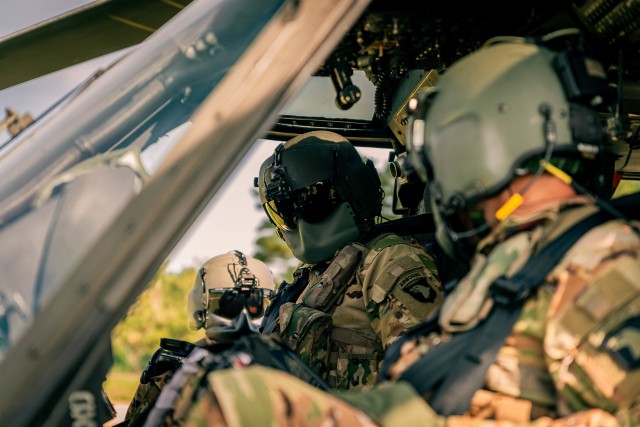101st Combat Aviation Brigade crew members check on each other before an orientation flight for Combined Resolve XIV Sept.13, 2020, Hohenfels, Germany. Combined Resolve XIV promotes regional stability, while increasing readiness, strengthening...