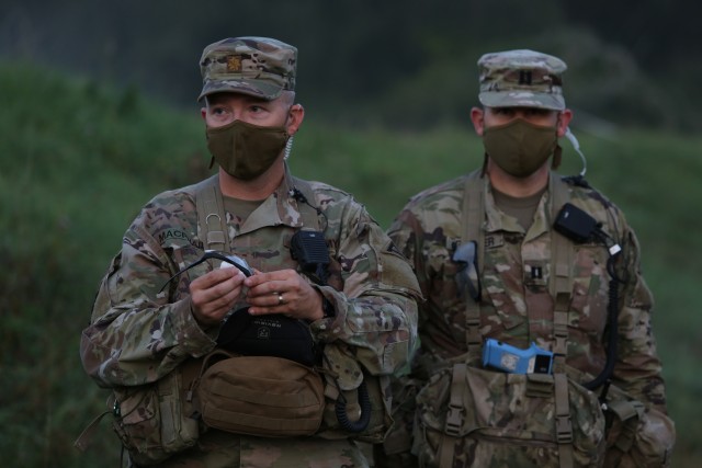 Observer Coach/Trainers  listen to a combined arms rehearsal in the Hohenfels Training Area on Sept. 16, 2020 as they prepare to head to the field to begin Combined Resolve XIV. Combined Resolve XIV is a Headquarters Department of the Army directed Multinational exercise designed to build 2nd Armored Brigade Combat Team, 3rd Infantry Division's readiness and enhance interoperability with allied forces to fight and win against any adversary. (U.S. Army photo by Spc Ravenne Eschbach).
