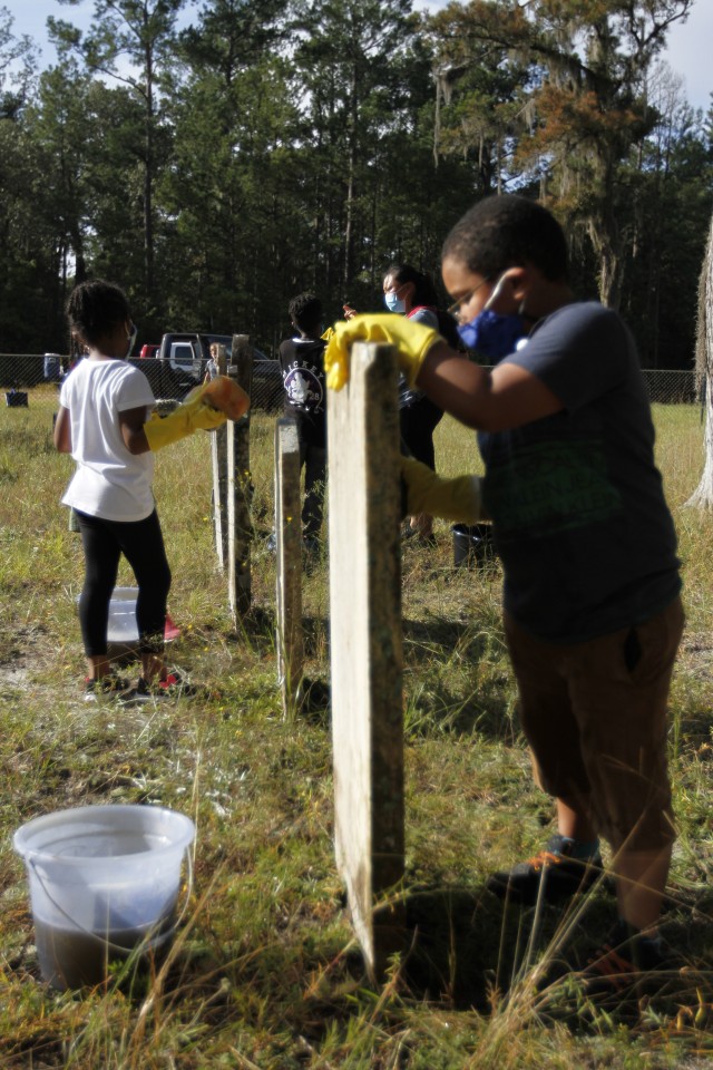 Children from Kessler, Murray and Diamond elementary schools clean headstones Sept. 25 at Taylors Creek Cemetery on Fort Stewart in honor of National Public Lands Day. The day is the nation's largest single-day volunteer event for public lands and...