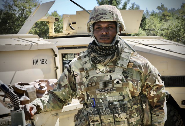 Army Reserve Spc. Javiere Mitchell, a chemical, biological, radiological and nuclear specialist and former outside linebacker for the Auburn College football team, assigned to 1st Platoon, 318th Chemical Company, 490th Chemical Battalion, 209th Regional Support Group, 76th Operational Response Command, poses for a portrait at Fort McCoy, Wis. Sept. 19. Mitchell and his unit are currently conducting a wide-variety of CBRN training at Fort McCoy, as part of Operation Desert Dragon, a two-week exercise designed to test the unit’s specialized capabilities in a variety of scenarios as they prepare for an upcoming deployment. 