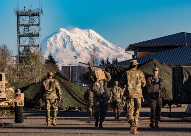 First Corps Soldiers at Warfighter Exercise 20-3 got a clear view of Mount Rainer, Feb. 10, 2020 at Joint Base Lewis-McChord, Washington -- a welcome break from the last week of rain and overcast skies. The command post exercise not only puts the corps through its battlefield tasks, but also incorporates the 25th Infantry Division, 593rd Expeditionary Sustainment Command, 40th Infantry Division, 42nd Military Police Brigade, 17th Field Artillery Brigade, 26th Maneuver Enhancement Brigade, and more. (U.S. Army photo by Spc. Isaac Weaver.)