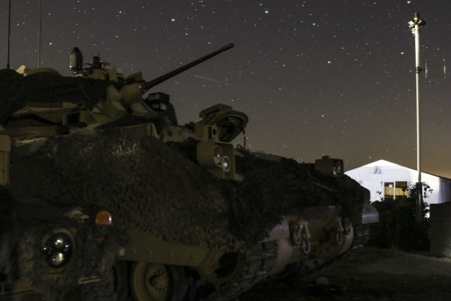 An M2 infantry fighting vehicle assigned to the Commander of 2nd Armored Brigade Combat Team, 3rd Infantry Division, stages outside of the brigade Tactical Operation Center for Exercise Combined Resolve XIV Sept. 16, 2020 at Hohenfels Training...