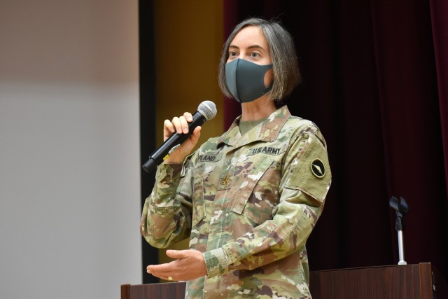Maj. Dawn Opland, planner for U.S. Army Reserve Affairs Japan, U.S. Army Japan, speaks during the Japan Ground Self-Defense Force Reserve Interpreters Training symposium at Camp Zama, Japan, Sept. 24, an event she helped organize.