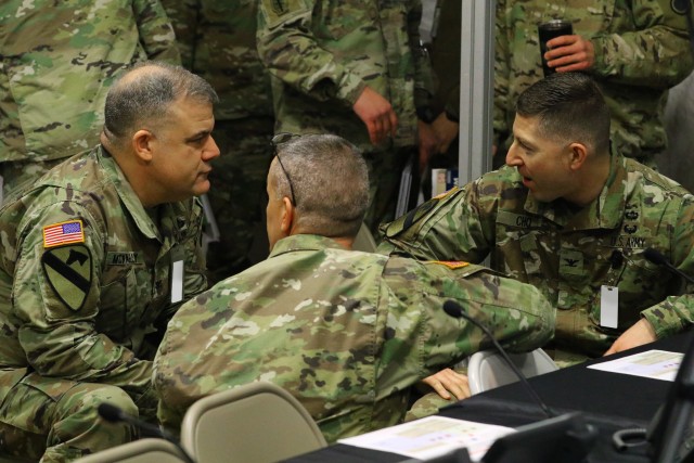 First Corps staff directorates compare notes before a targeting briefing during Warfighter Exercise 20-3 on Joint Base Lewis-McChord, Feb. 11, 2020. (U.S. Army photo by Spc. Joseph E.D. Knoch.)