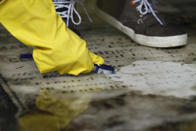 Children of Department of Defense Education Activity schools on Fort Stewart clean headstones as part of National Public Lands Day Sept. 25 at Taylors Creek Cemetery on post. The children bounced from headstone to headstone in groups or on their...