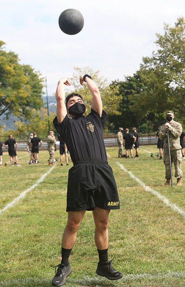 A cadet performs the Standing Power Throw.