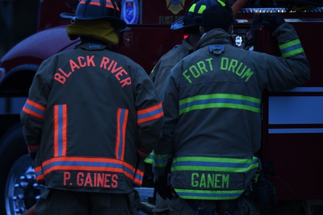Firefighters from Fort Drum Fire and Emergency Services Division and Black River Volunteer Fire Department team up for a mutual aid nighttime live fire training event Sept. 29 at the Fort Drum Fire Department Training Center at Wheeler-Sack Army...