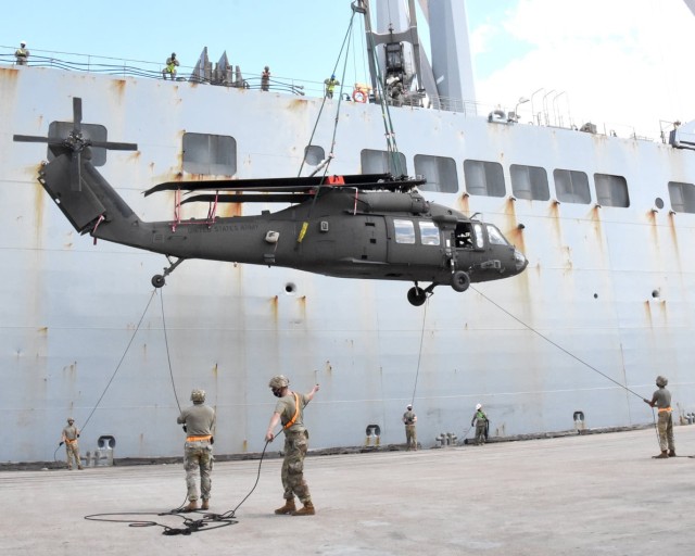Soldiers with the 2nd Aviation Battalion, 25th Aviation Regiment, offload a helicopter at the Port of Beaumont, Texas, Sept. 26 as part of Joint Readiness Exercise 20. The helicopters will be flown to the Joint Readiness Training Center and Fort...