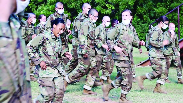 A trainee makes her way through the Combat Conditioning Course as platoon members encourage her on at Fort Sill, Oklahoma. This first Basic Combat Training obstacle course tests trainees’ mental and physical endurance while building teamwork...
