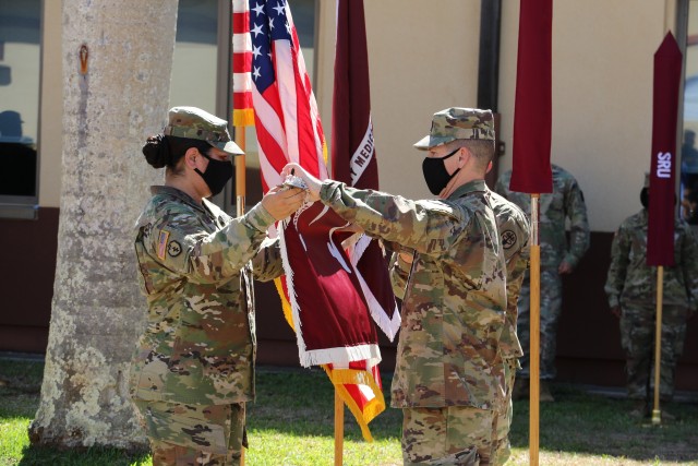 Lt. Col. Marie F. Slack, Soldier Recovery Unit command and Command Sgt. Maj. Christian G. Davis case the colors of the Warrior Transition Battalion.